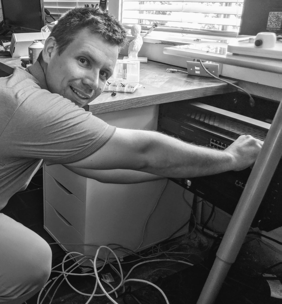 Hans Arndt installing a server rack